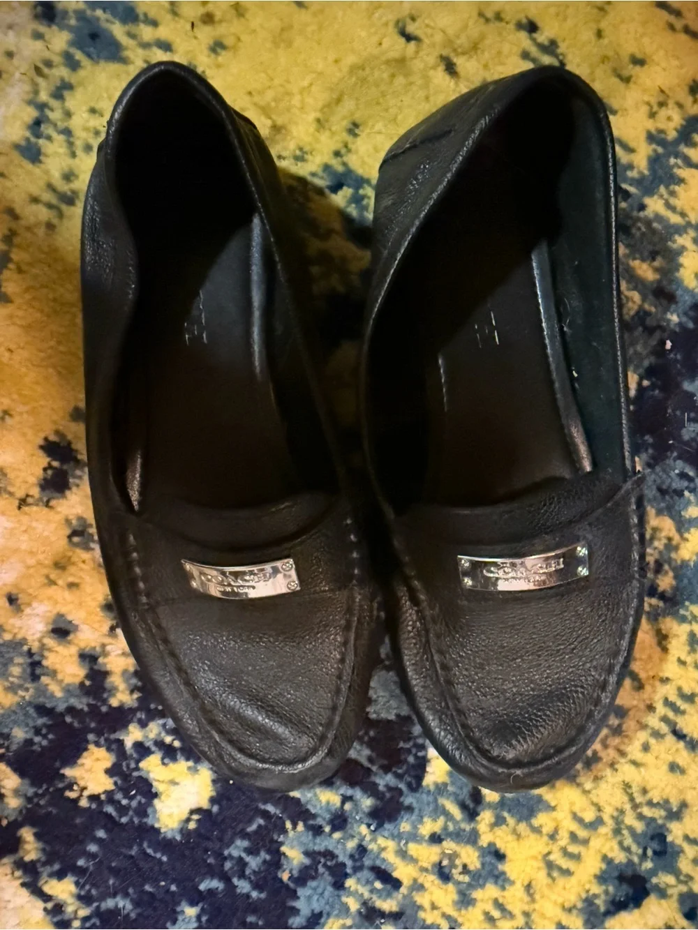 Coach Black Leather Slip-On Loafers with Silver Plaque
